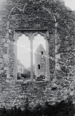 ROUND TOWER THROUGH WINDOW OF OLD CHURCH